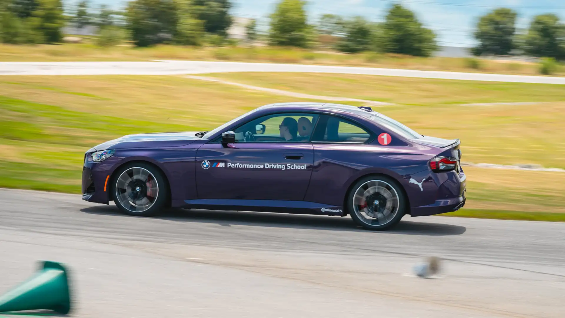 Purple BMW M2 from the M Performance Driving School on track