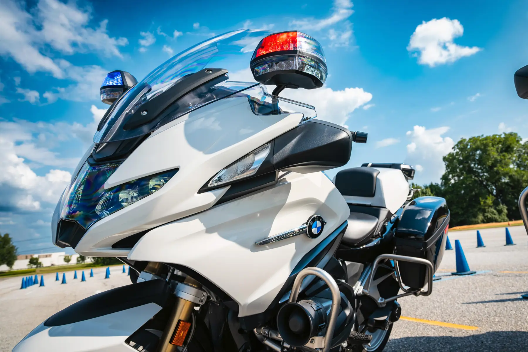 Close-up of a white BMW police motorcycle with its light bar