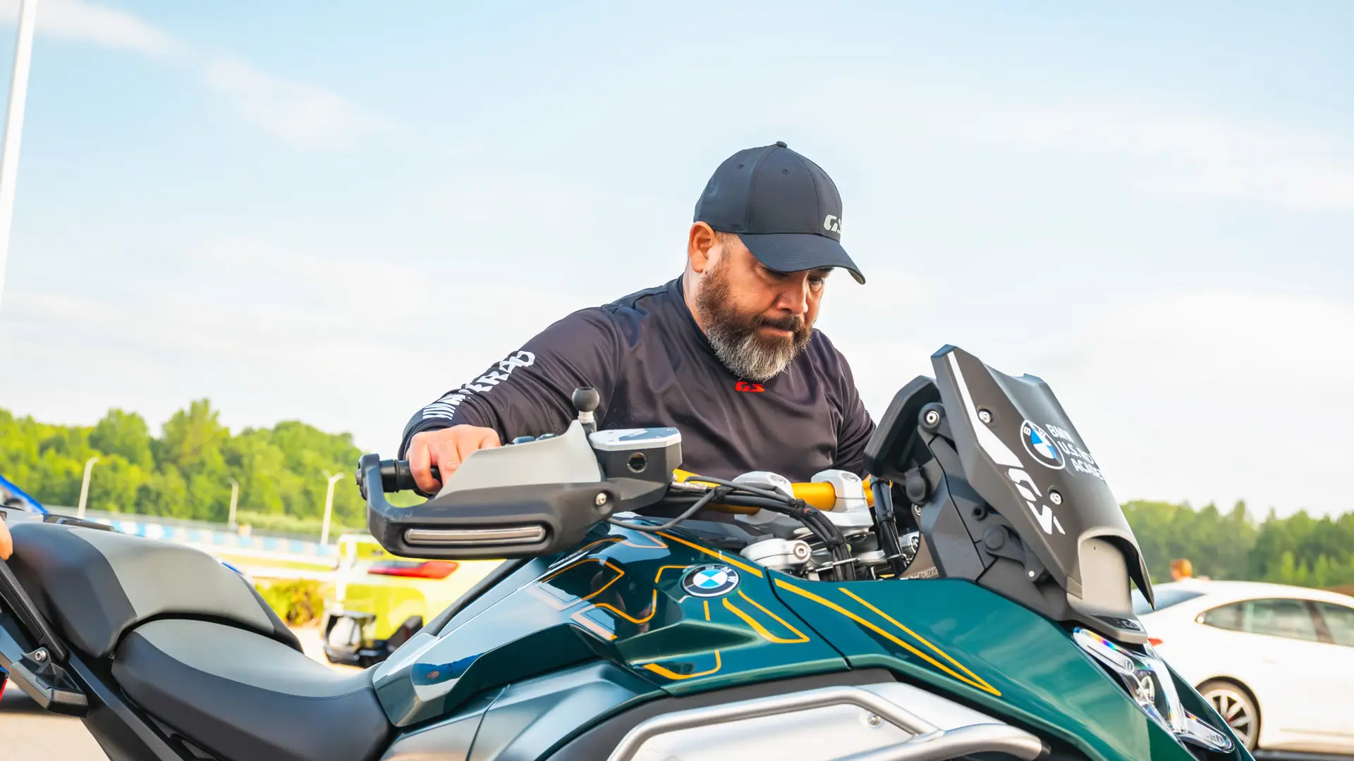 Instructor adjusting the controls on a BMW GS