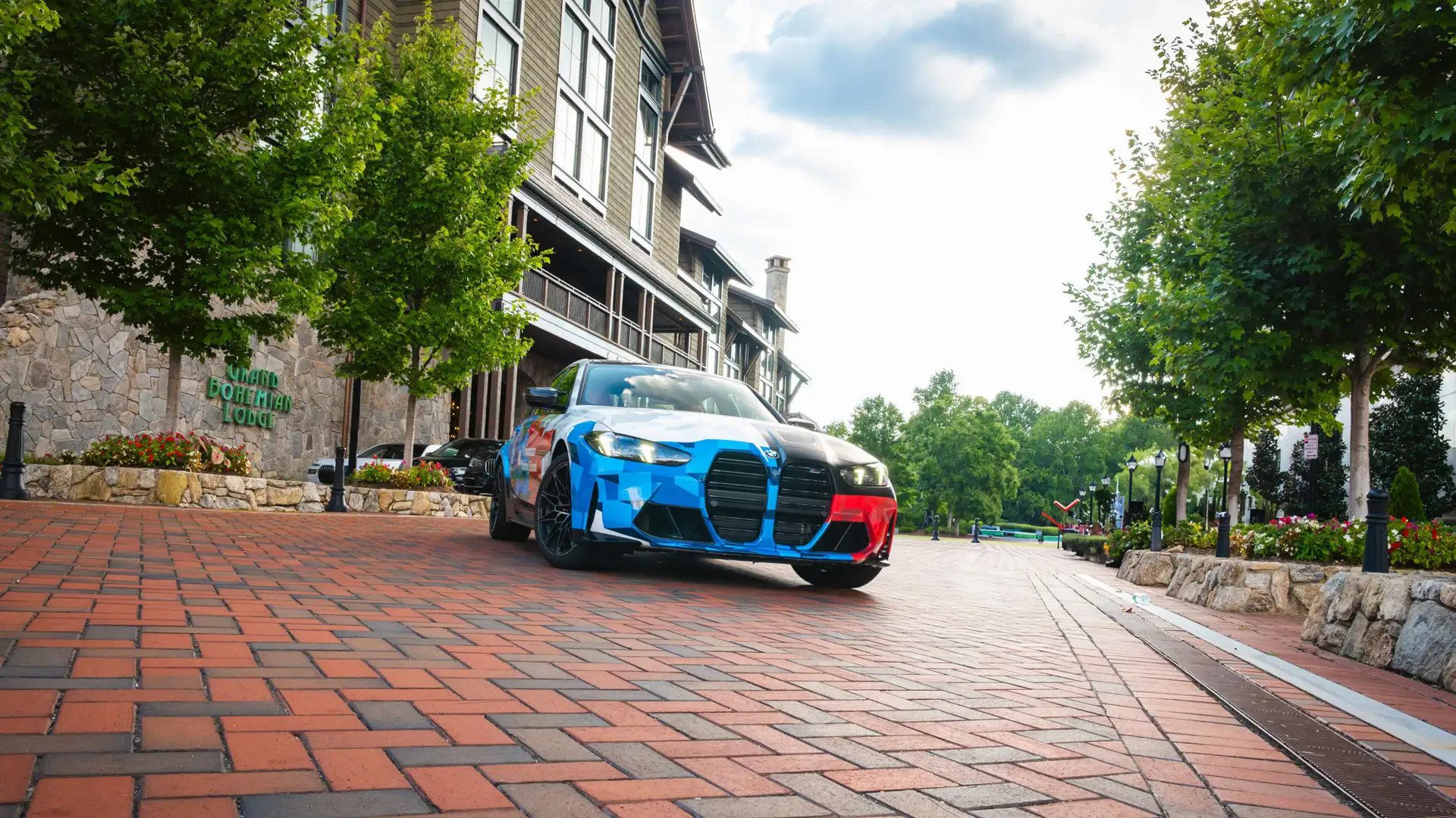 BMW M3 in Motorsport livery parked outside the Grand Bohemian Lodge