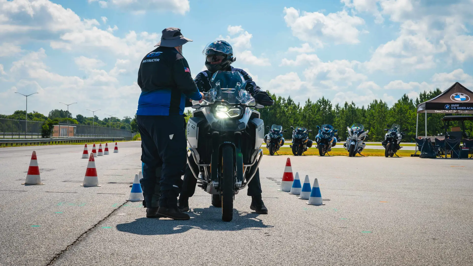 Instructor coaching a rider one to one on the training pad