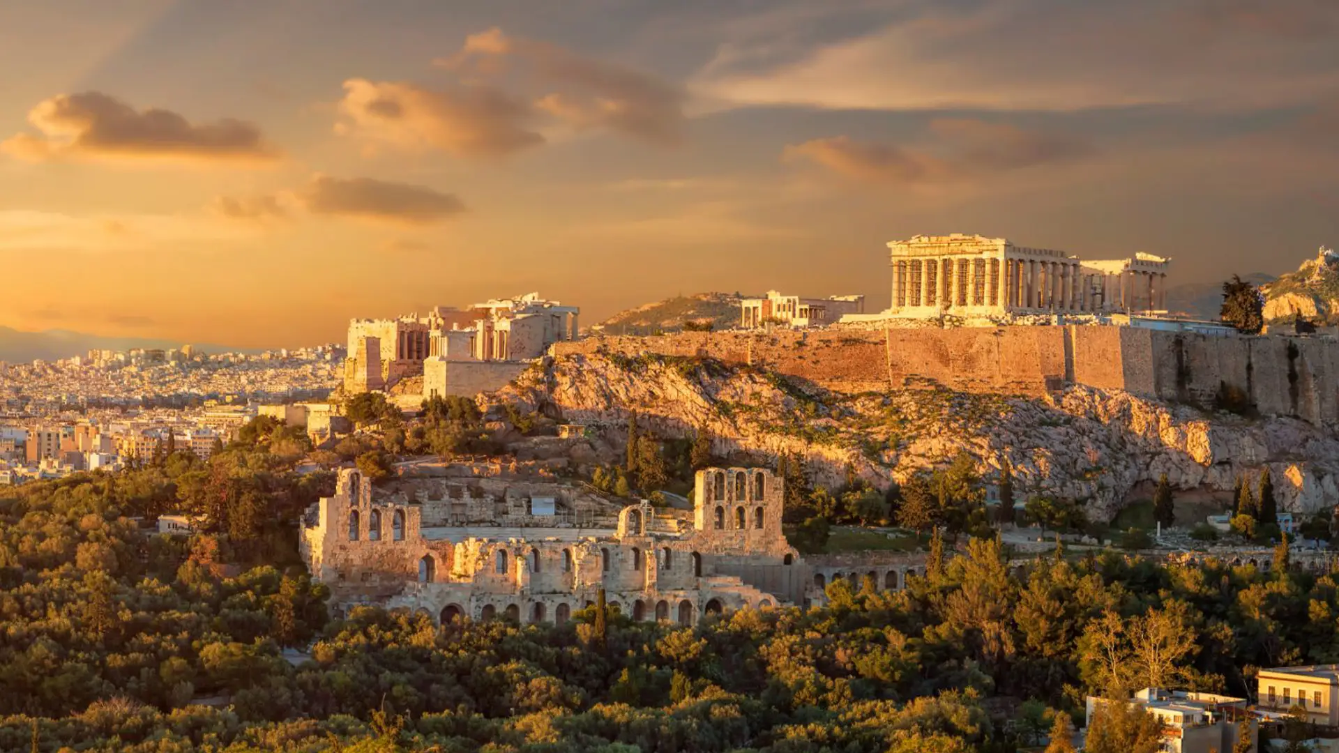 The Acropolis of Athens glowing at sunset above the city