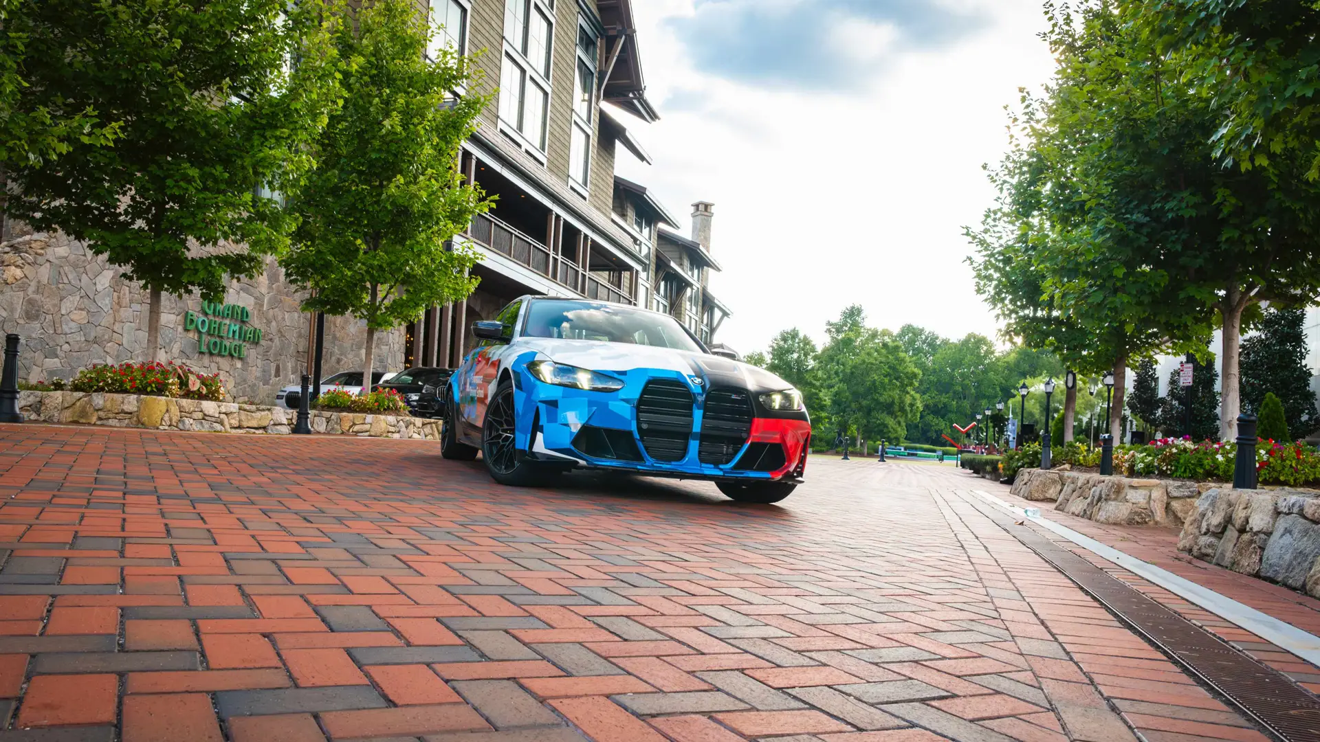 BMW M3 in Motorsport livery on the brick street outside the Grand Bohemian Lodge