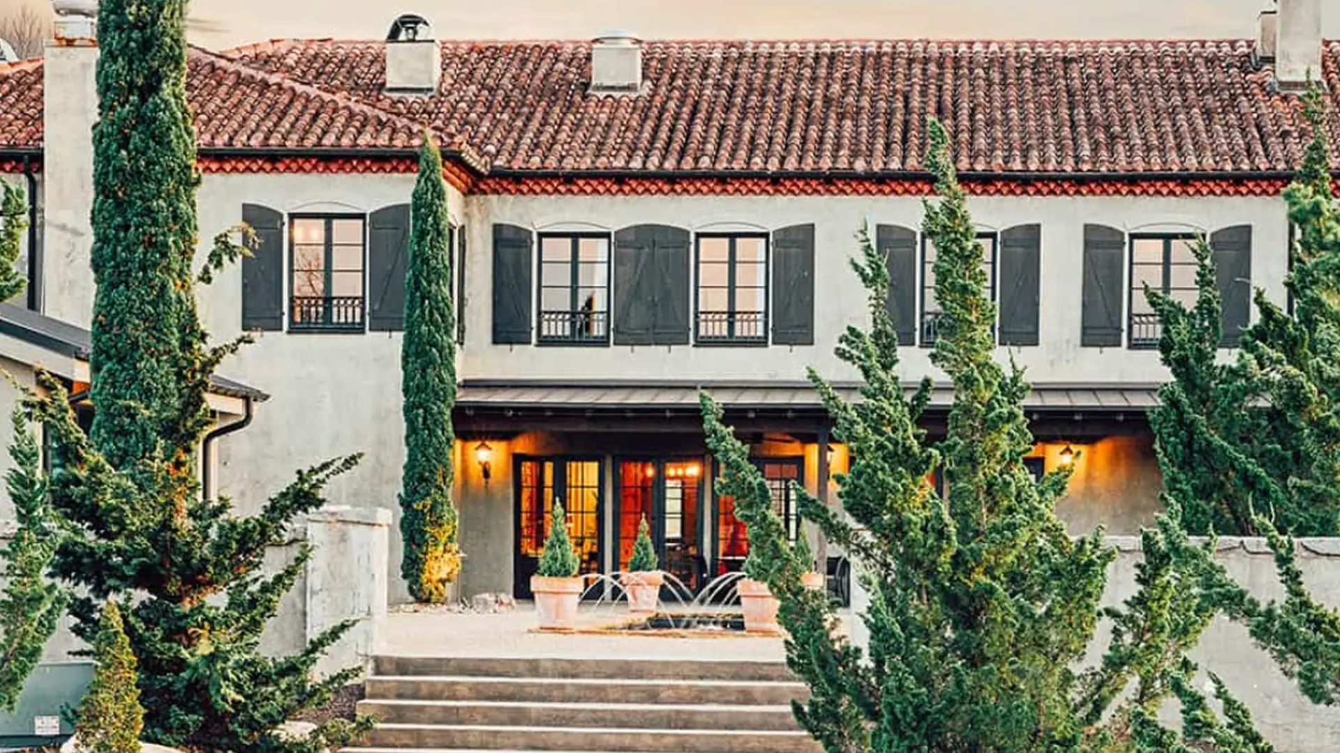 Hotel Domestique with cypress trees along its terrace