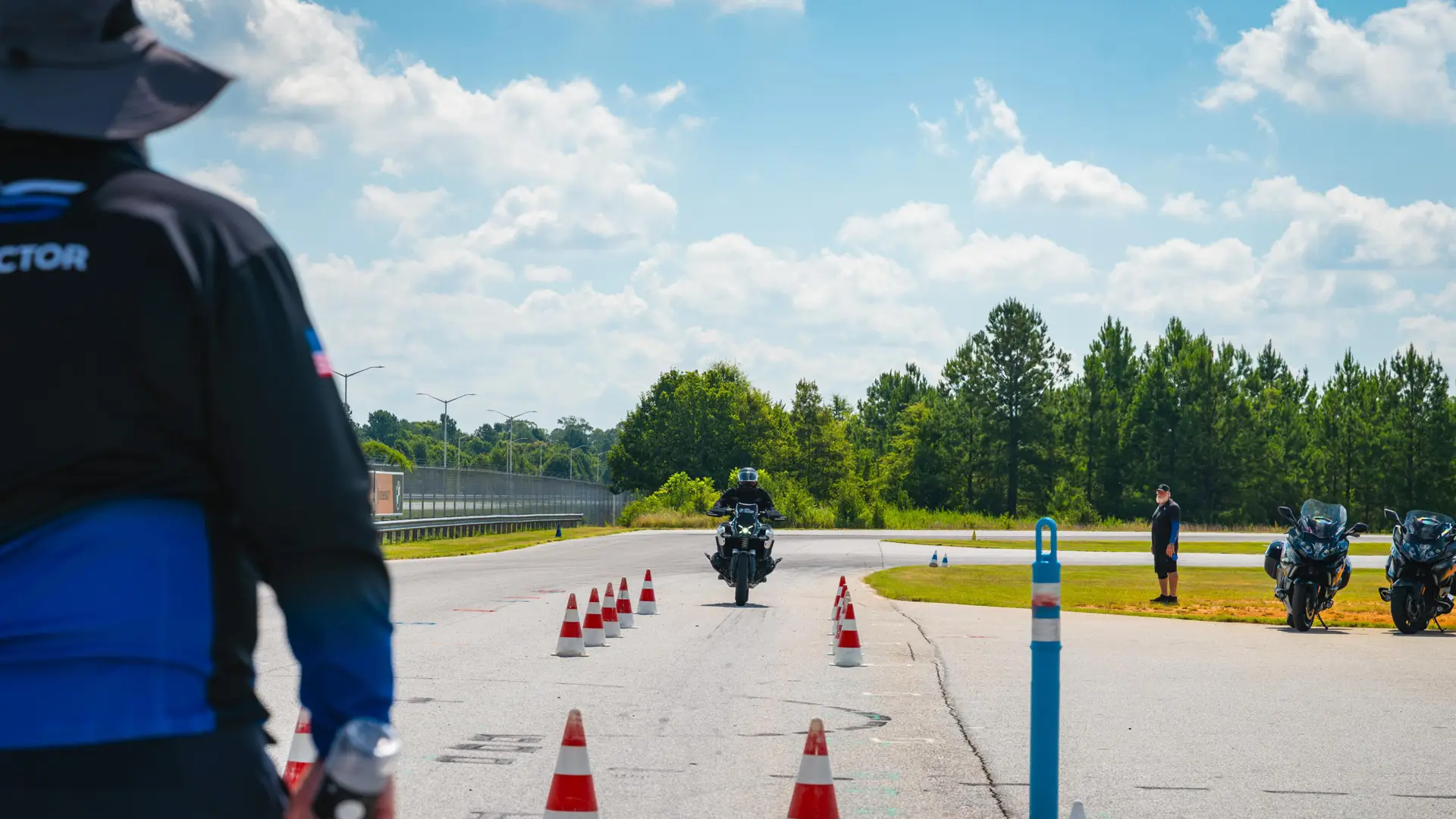 Instructor watching a rider approach through a coned exercise