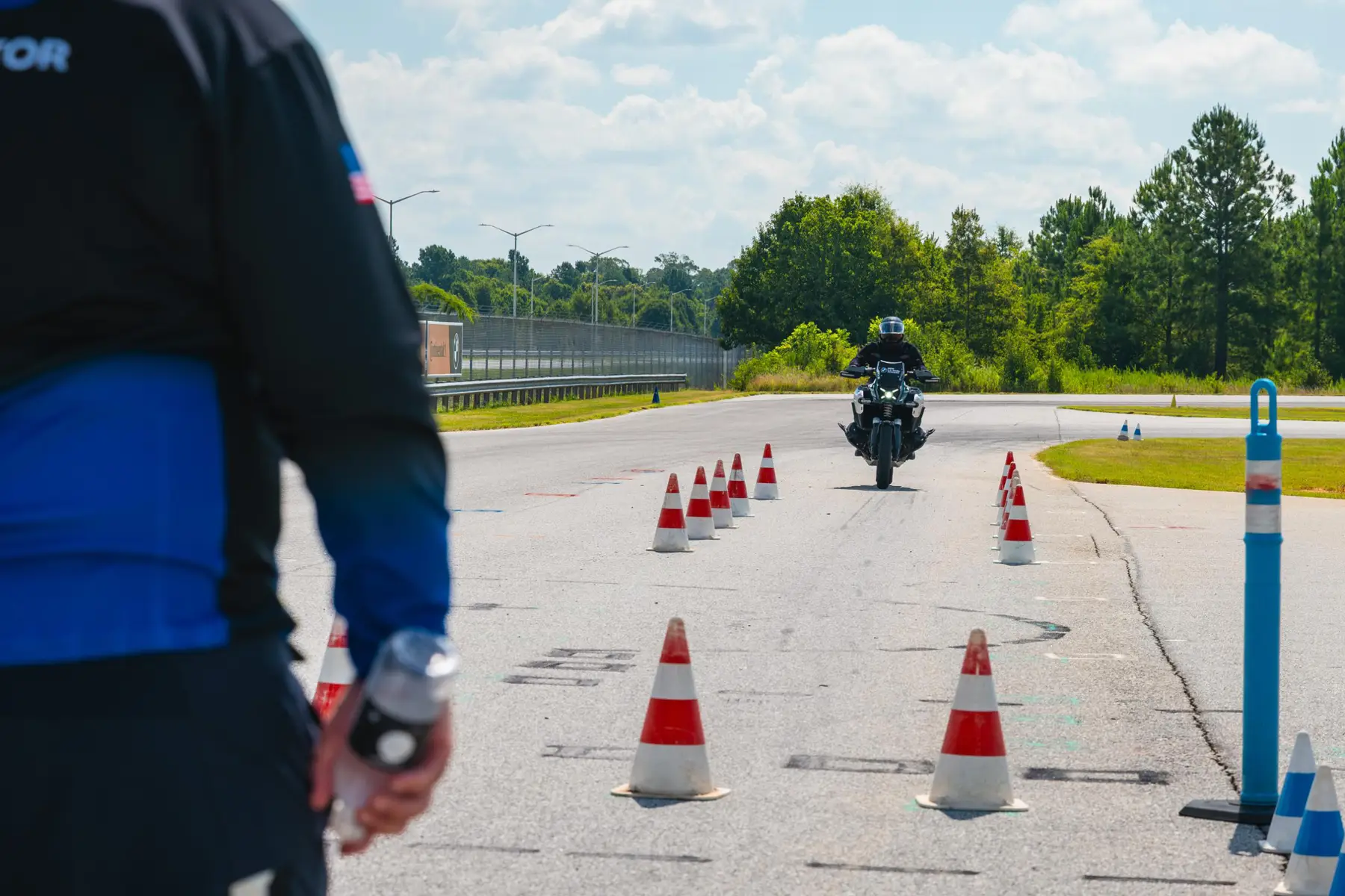 Instructor watching a rider come through a coned slalom