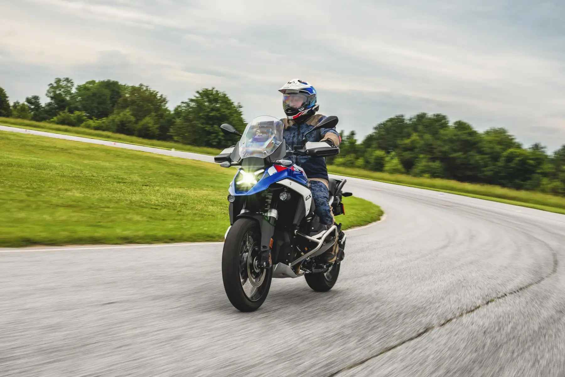 Rider on a BMW GS sweeping through a bend on the road course