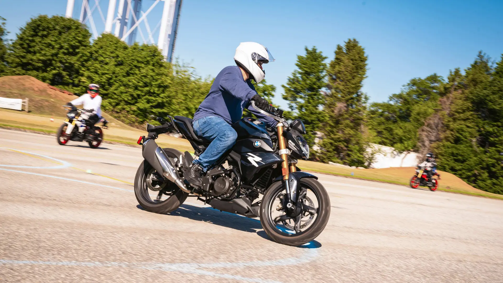 Rider leaning a BMW G 310 R through a marked curve